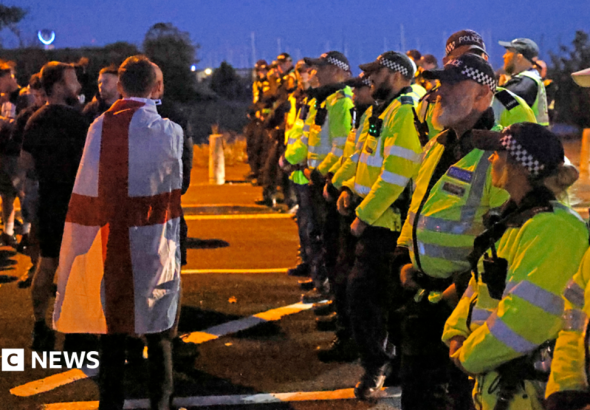 Protesters gather as migrants brought ashore at Gosport