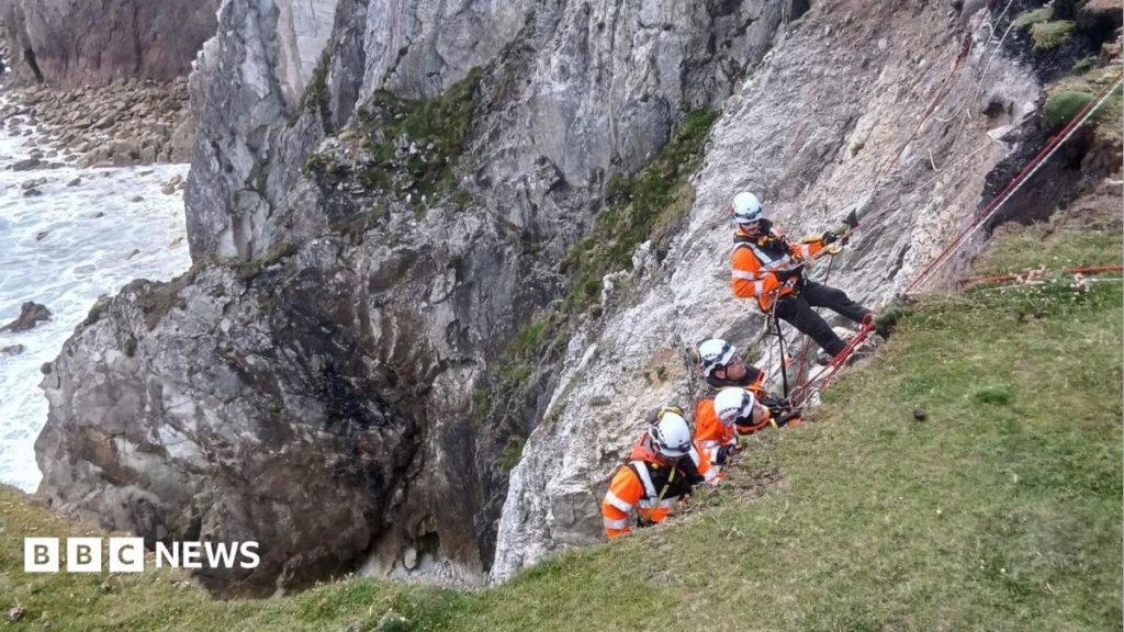 Dramatic clifftop rescue of bride and groom-to-be Dramatic clifftop rescue of bride and groom-to-be