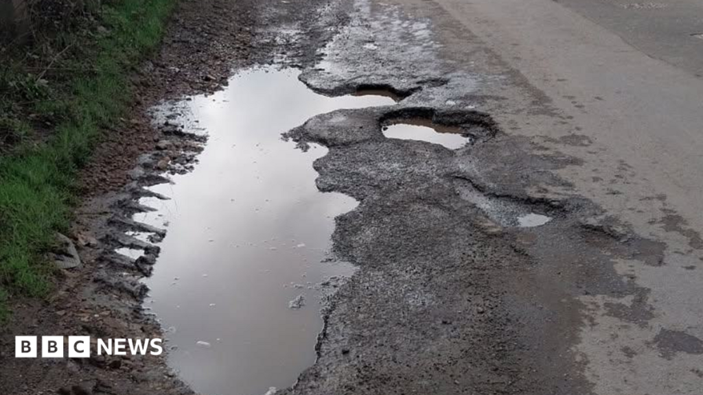 Photos show potholes days before fatal crash Photos show potholes days before fatal crash